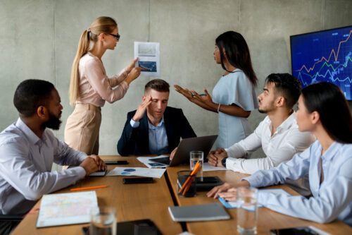 Conflicts At Workplace. Businss Team Suffering Communication Problem During Meeting In Office