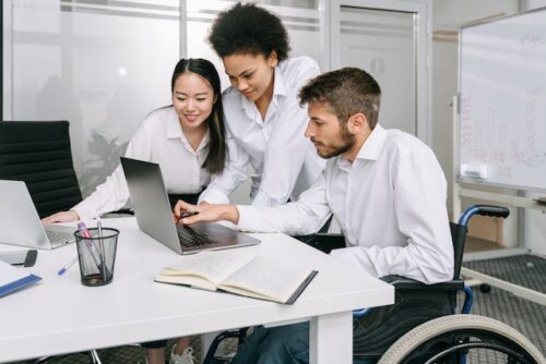 man working with coworkers