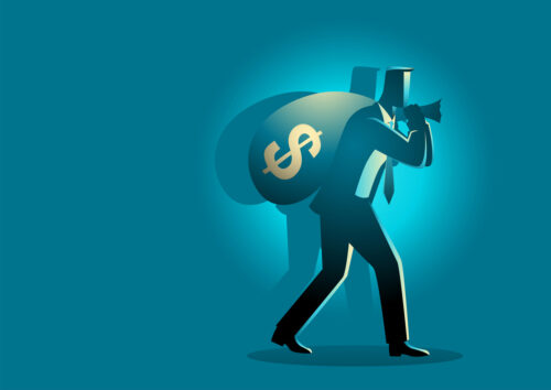 Businessman carrying money bag on his shoulder